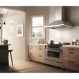 Elica ELN148SS EL-LEONE 48" WALL MOUNT CHIMNEY HOOD in modern kitchen with wooden cabinetry and gas range.
