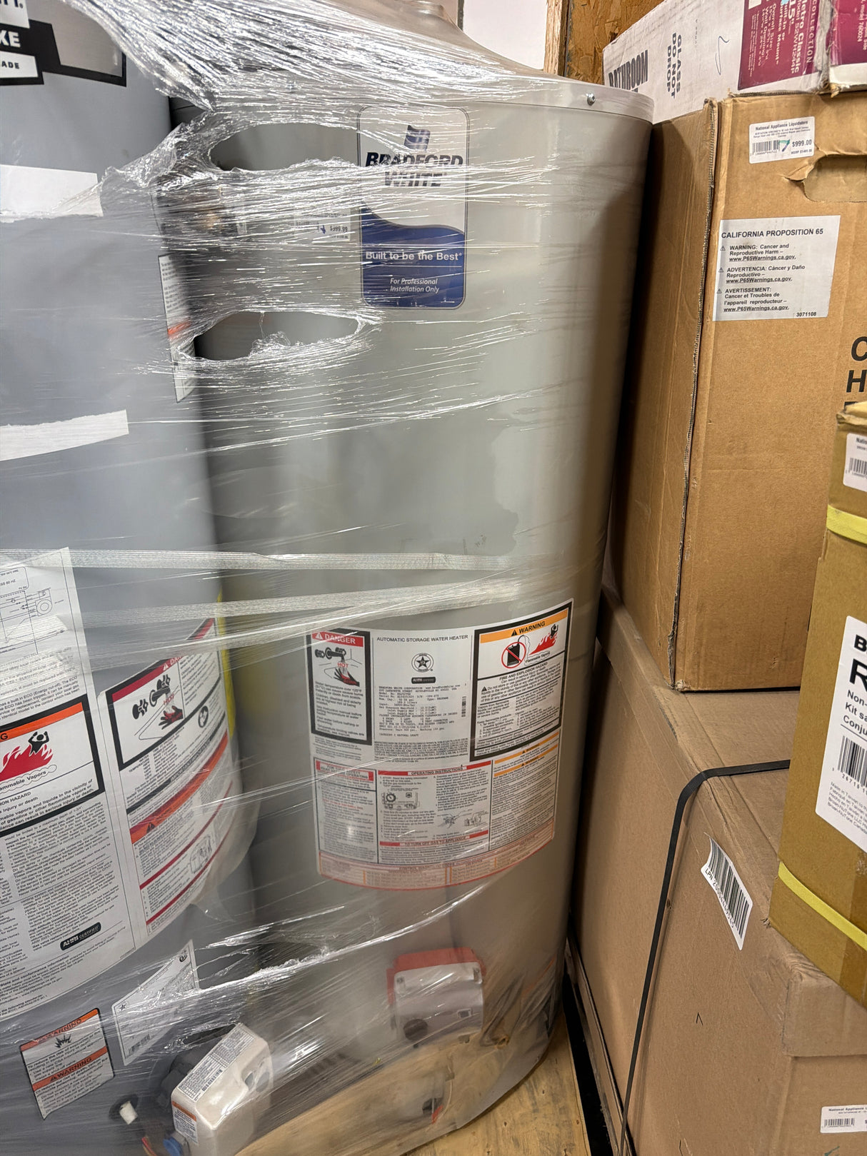 Bradford White RG250T6X - 50-Gallon 35,000 BTU Liquid Propane Tall Atmospheric Vent Water Heater in packaging.