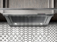 Elica EGL430S1 EL-30" UC HOOD GLIDE SS & CLEAR GLASS installed above patterned tiles.