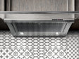 Elica EGL436S1 EL-36" UC HOOD GLIDE SS & CLEAR GLASS installed in stylish kitchen above decorative tiles.