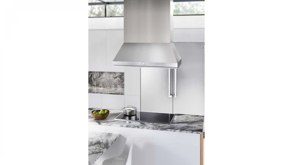 Stainless steel range hood in modern kitchen