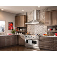 BEST WPP9E36SB 36 Inch Wall Mount Chimney Range Hood with Optional External Blowers, 3-Speed Plus Boost Control, Heat Sentry, Delay Timer, Halogen Lights and Hi-Flow Baffle Filters in a modern kitchen.