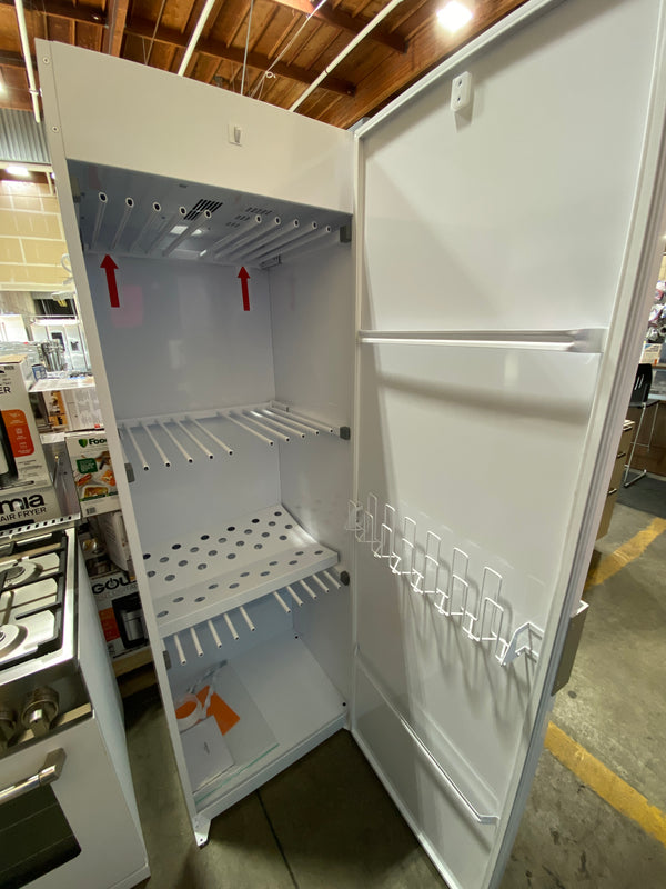 Open white freestanding refrigerator interior with shelves