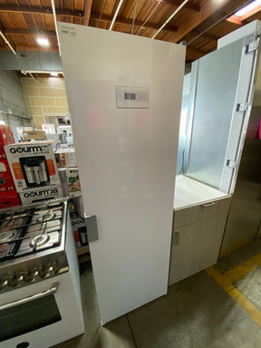 ASKO DC7784VW Freestanding Drying Cabinet next to a built-in refrigerator in an appliance liquidation warehouse.