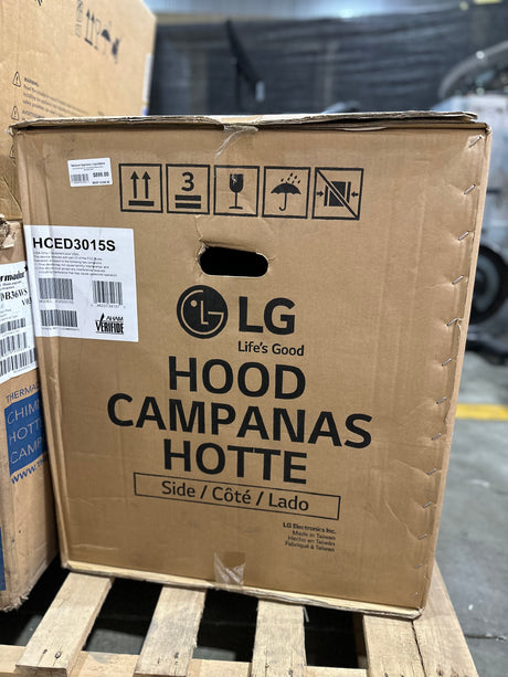 LG HCED3615S 36" Convertible Range Hood - stainless steel packaging box in warehouse setting.