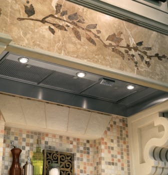 Monogram range hood with decorative design